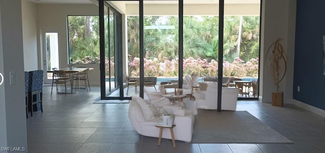 interior space featuring expansive windows and tile patterned flooring