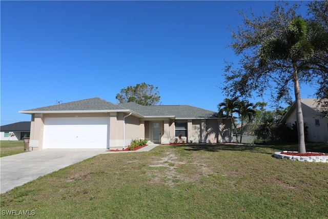 view of front of property featuring a front yard and a garage