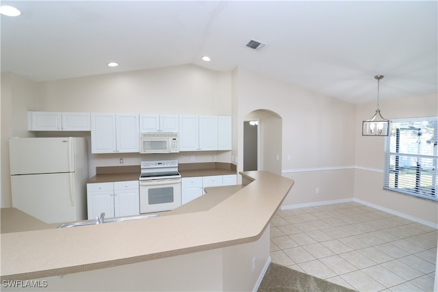 kitchen with lofted ceiling, white cabinets, hanging light fixtures, light tile patterned floors, and white appliances