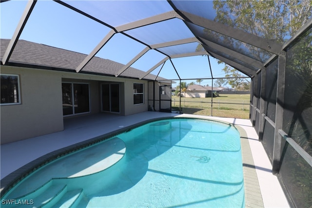 view of pool featuring a patio area and a lanai