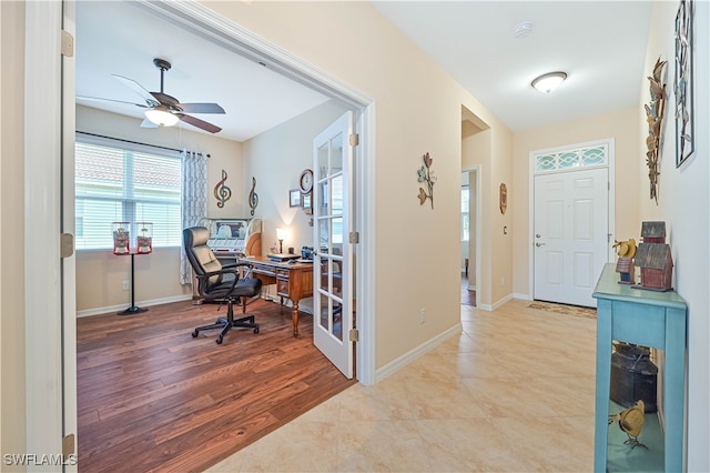 interior space featuring ceiling fan and light hardwood / wood-style flooring