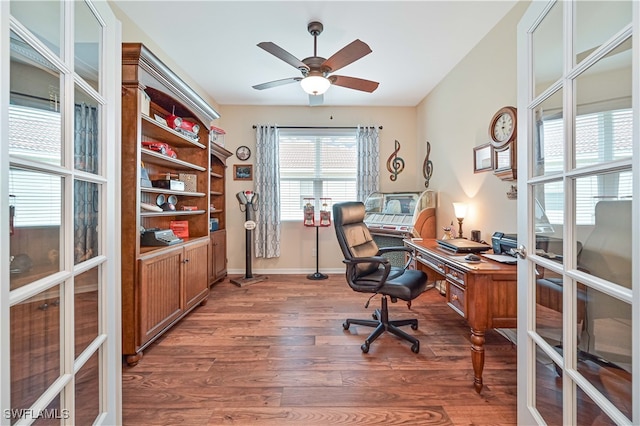 office area with ceiling fan, french doors, and dark hardwood / wood-style floors