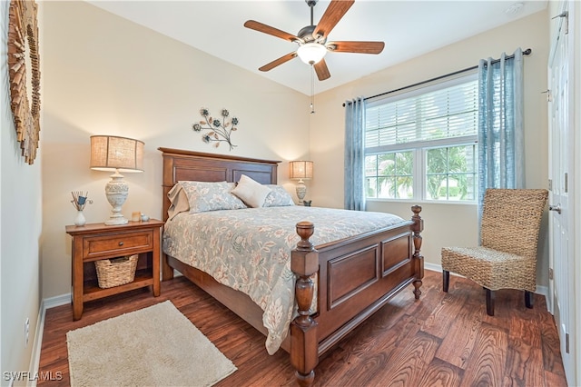 bedroom featuring dark hardwood / wood-style floors and ceiling fan