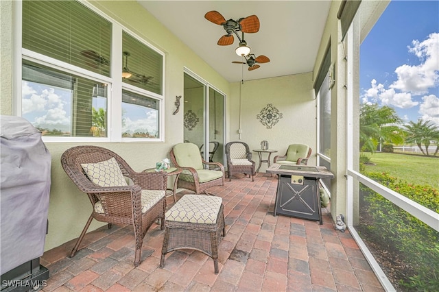 sunroom / solarium with ceiling fan