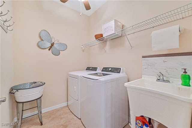 laundry room with ceiling fan, sink, and washer and clothes dryer