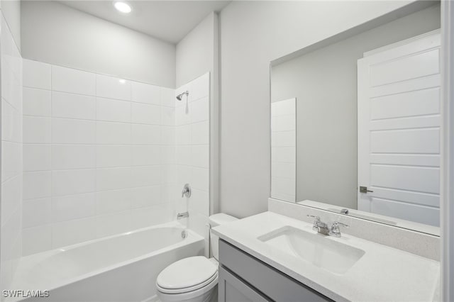 full bathroom featuring vanity, toilet, and tiled shower / bath combo