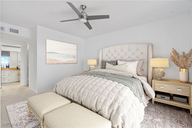 bedroom featuring ceiling fan and ensuite bathroom