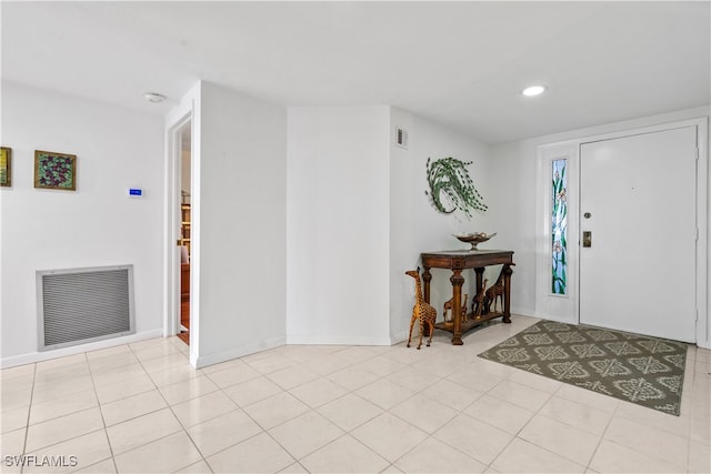 entrance foyer with light tile patterned floors