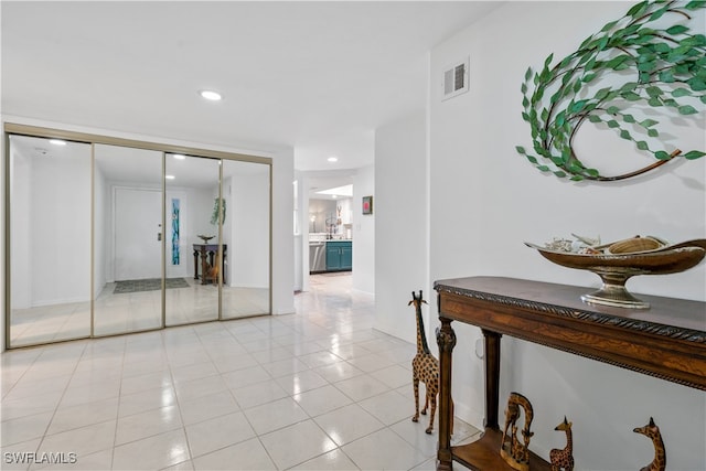 corridor with light tile patterned flooring