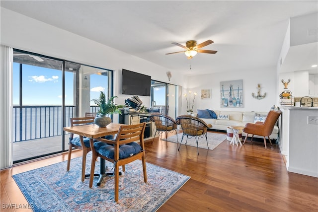 dining room featuring ceiling fan and dark hardwood / wood-style floors