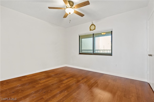 empty room featuring ceiling fan and hardwood / wood-style floors