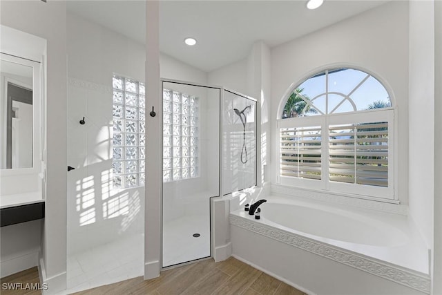 bathroom with vanity and plus walk in shower