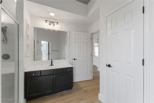 bathroom with vanity and walk in shower