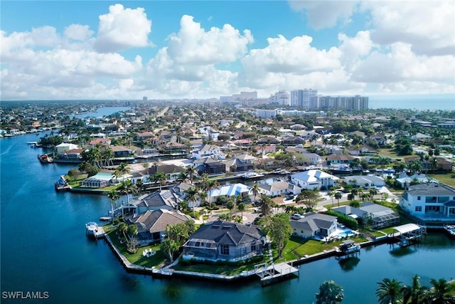 bird's eye view featuring a water view and a residential view