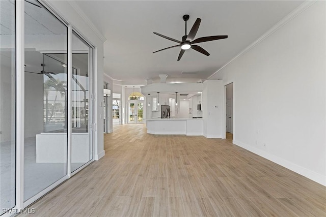 unfurnished living room with light hardwood / wood-style floors, ceiling fan, and ornamental molding