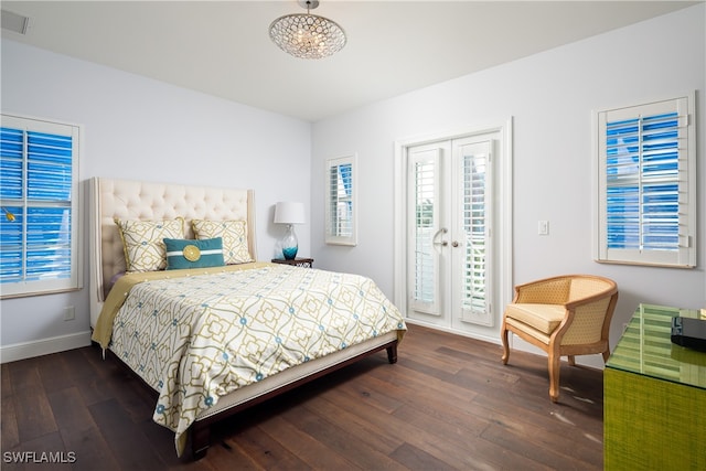 bedroom featuring french doors, access to outside, and dark hardwood / wood-style floors