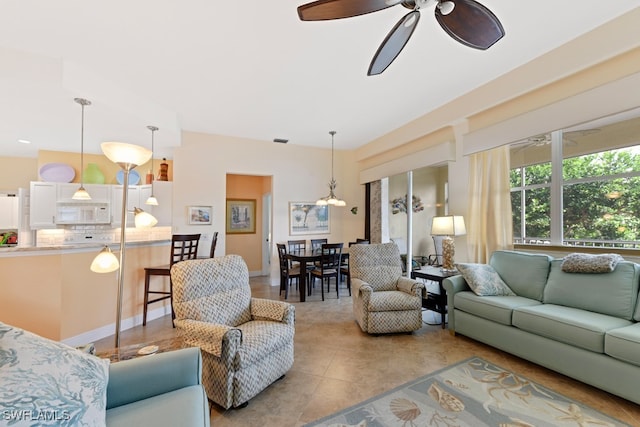 tiled living room with ceiling fan