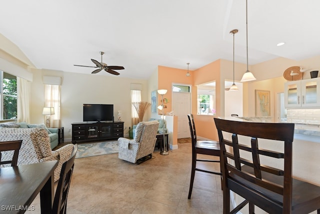 living room featuring light tile patterned floors and ceiling fan