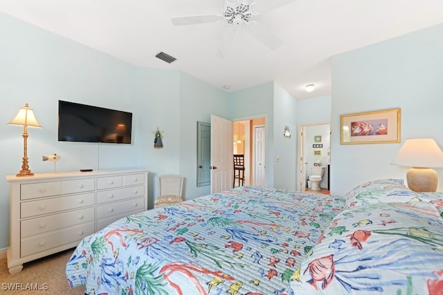 carpeted bedroom with ceiling fan and ensuite bathroom