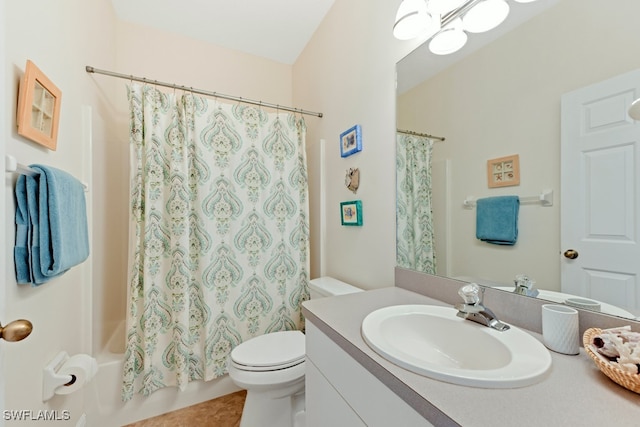 full bathroom with tile patterned flooring, vanity, shower / bath combo, and toilet