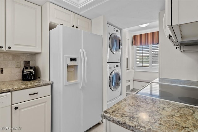 7500 Estero Blvd Unit 203, Fort Myers Beach, FL 33931 - laundry room featuring stacked washer / drying machine