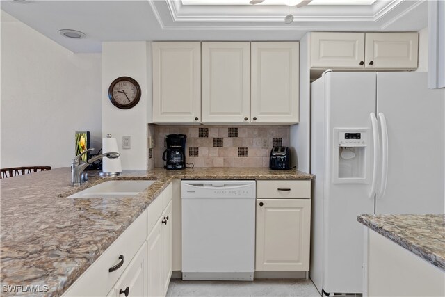 kitchen featuring white cabinets, white appliances, and sink