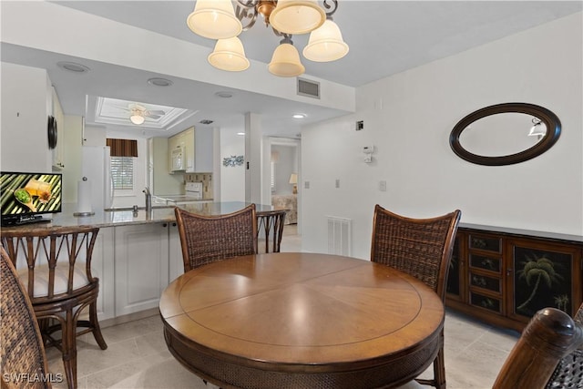 7500 Estero Blvd Unit 203, Fort Myers Beach, FL 33931 - dining room featuring attic access