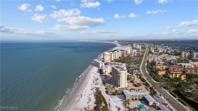 aerial view with a water view and a beach view