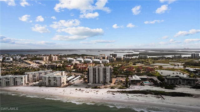 drone / aerial view with a water view and a view of the beach