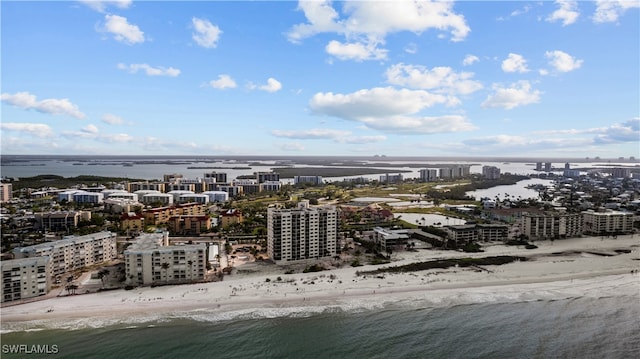 birds eye view of property featuring a water view and a view of the beach