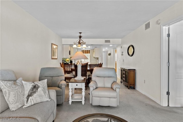 7500 Estero Blvd Unit 203, Fort Myers Beach, FL 33931 - living area with light colored carpet and a chandelier