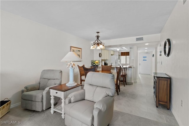 7500 Estero Blvd Unit 203, Fort Myers Beach, FL 33931 - living area featuring a chandelier and baseboards
