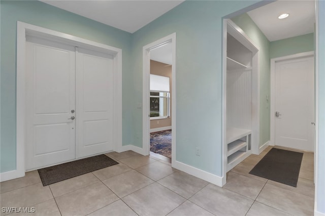 entryway featuring light tile patterned flooring