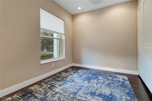 spare room featuring dark hardwood / wood-style floors