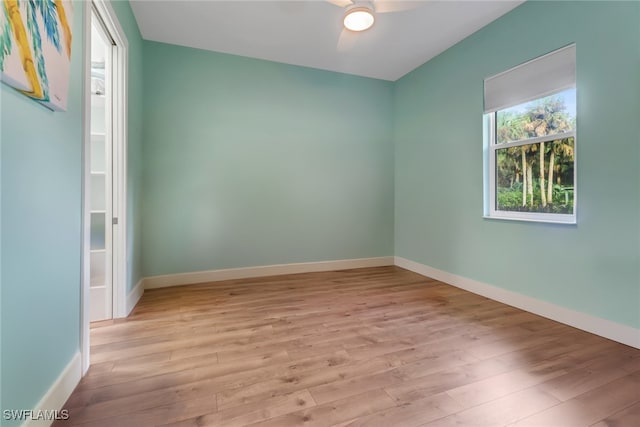 empty room featuring ceiling fan and light wood-type flooring