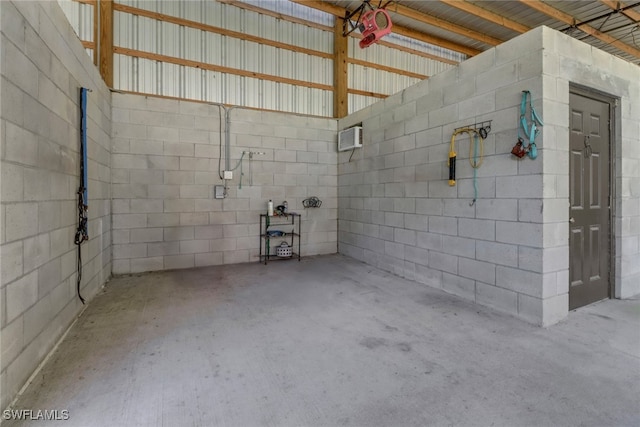 garage with a wall mounted air conditioner