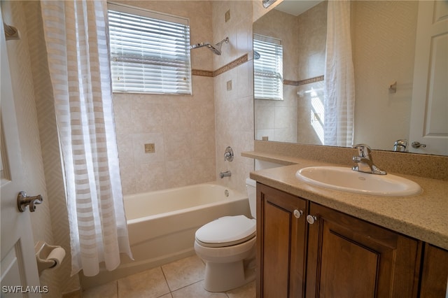 full bathroom with toilet, tile patterned floors, shower / tub combo with curtain, and vanity