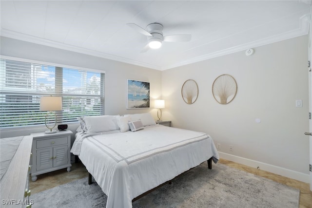 bedroom with ceiling fan and crown molding