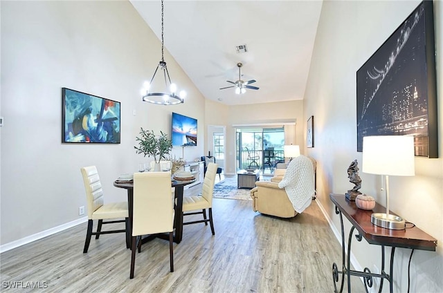 28080 Cavendish Ct Unit 2007, Bonita Springs, FL 34135 - dining room featuring wood finished floors, a ceiling fan, and high vaulted ceiling