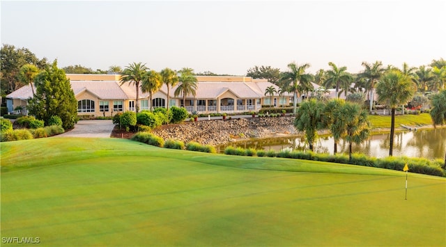 view of property's community featuring a water view and a yard