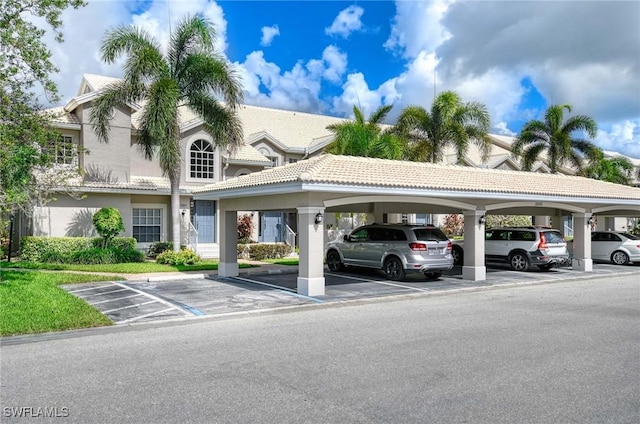 28080 Cavendish Ct Unit 2007, Bonita Springs, FL 34135 - view of partially covered parking lot