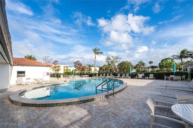 view of swimming pool featuring a patio