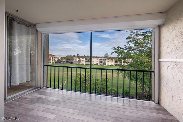 unfurnished sunroom featuring a healthy amount of sunlight