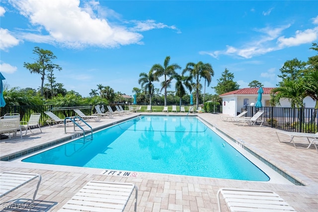 view of swimming pool with a patio area