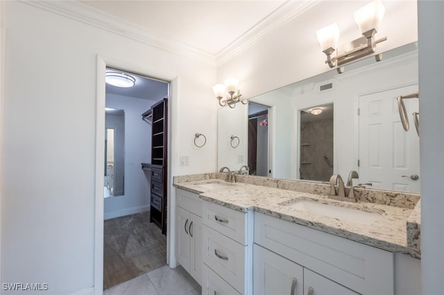 bathroom featuring hardwood / wood-style flooring, vanity, and crown molding