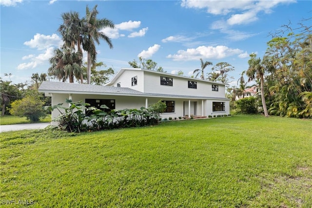 8531 Yorkshire Ln, Fort Myers, FL 33919 - view of front facade with a front lawn and stucco siding