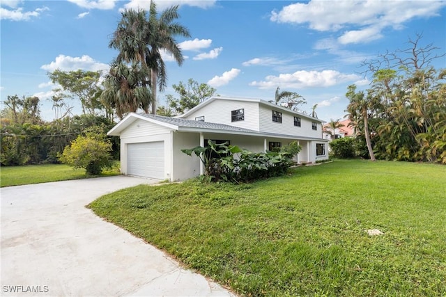 8531 Yorkshire Ln, Fort Myers, FL 33919 - view of front of home with concrete driveway, a front lawn, and a garage