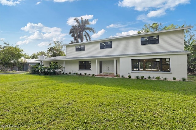 8531 Yorkshire Ln, Fort Myers, FL 33919 - view of front of home with a front yard and stucco siding