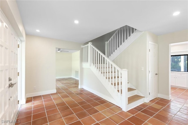8531 Yorkshire Ln, Fort Myers, FL 33919 - staircase with tile patterned flooring, recessed lighting, and baseboards