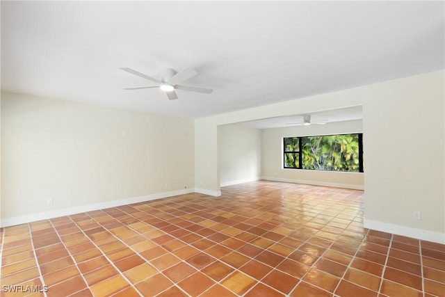 8531 Yorkshire Ln, Fort Myers, FL 33919 - empty room with ceiling fan, baseboards, and tile patterned flooring
